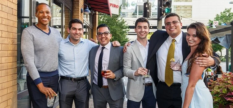 A man and woman embrace while singing