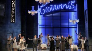 Don Giovanni in a white dinner jacket raises a glass beneath a neon Giovanni's Supper Club sign in Don Giovanni