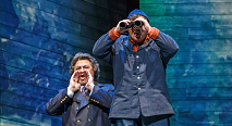 Daland peers through binoculars beside the Steersman calling out in Pittsburgh Opera's The Flying Dutchman