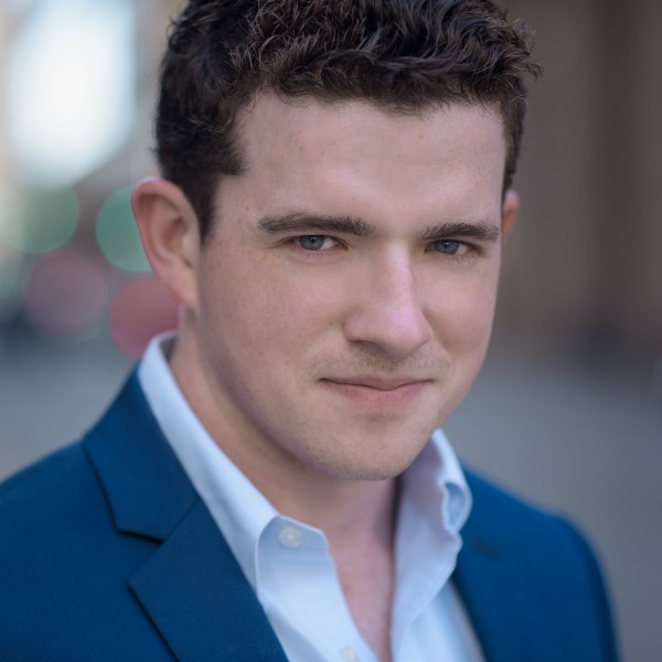 Emmett O'Hanlon, portrait; Figaro in Pittsburgh Opera's The Barber of Seville, 2023