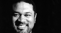 Gordon Hawkins smiling, black and white portrait