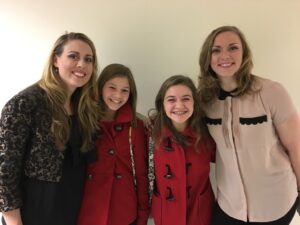 Adelaide Boedecker, Meredith and Maddie Kocur in red coats, and Corrie Stallings after Little Women