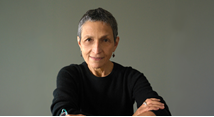 Composer Laura Kaminsky in black with arms crossed, portrait