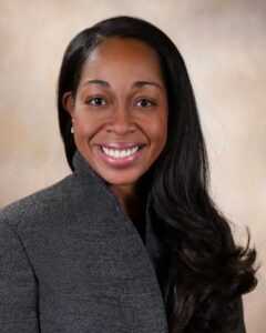 Dena LaMar in a grey blazer, portrait