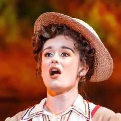 Natasha Wilson in costume as Rosalba, singing in a straw boater, in Pittsburgh Opera's Florencia en el Amazonas