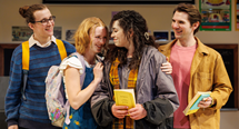 Four teenage characters huddle in a school hallway in Pittsburgh Opera's Time to Act