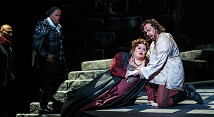 Manrico kneels over the dying Leonora as Count di Luna watches in Pittsburgh Opera's Il Trovatore