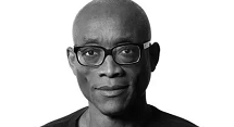 Bill T. Jones in glasses, black and white portrait