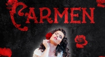 Carmen in a white blouse among red roses; Pittsburgh Opera Carmen key art