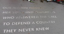 Memorial inscription in stone honoring those who defended a country they never knew